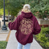 Featuring the bold phrase "Find Your Wild" crafted in a unique tree branch letter font, this hoodie is a celebration of the untamed beauty of the forest and the freedom it inspires.